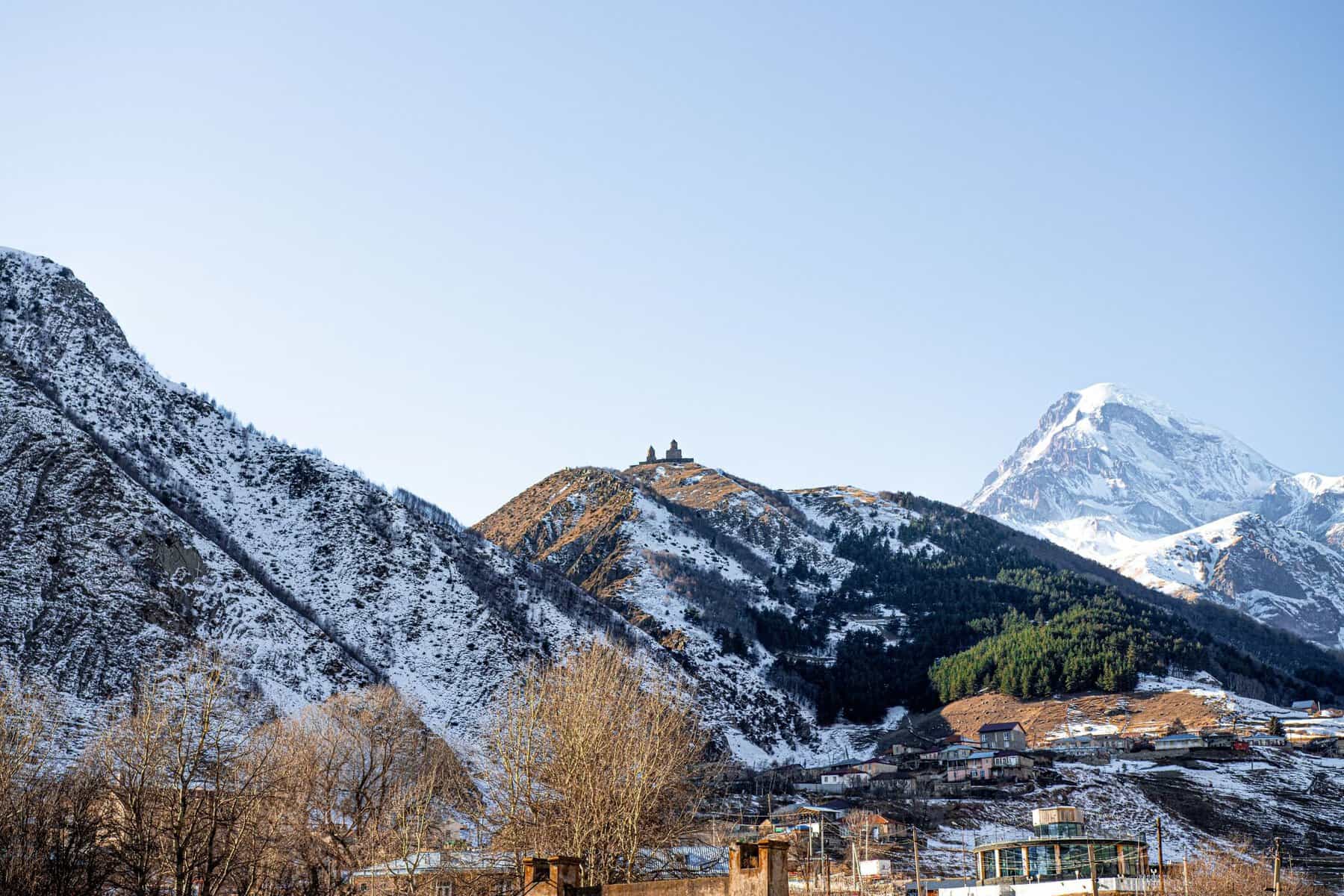 Snow-capped Mount Kazbek above Gergeti Trinity Church