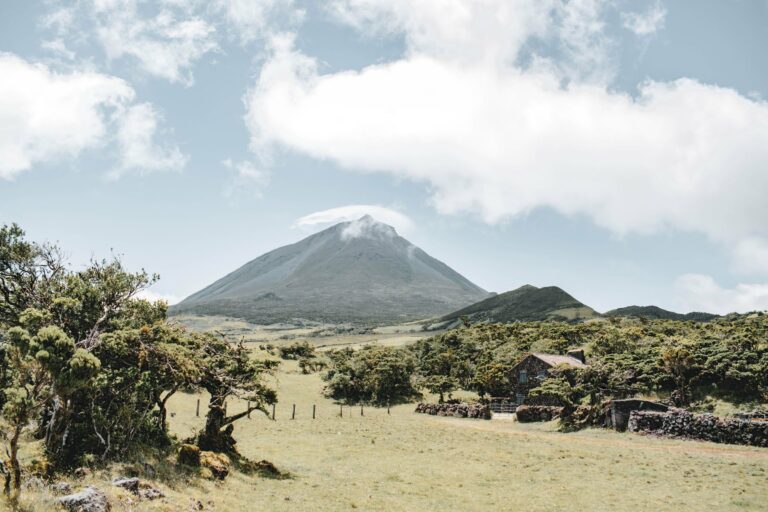 Mount Pico above green fields in the Azores