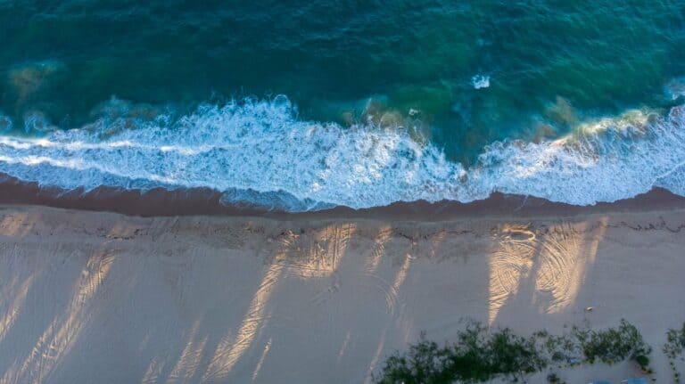 Waves breaking on a sandy beach in Mozambique