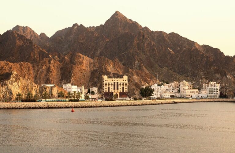 The coast of Muscat beneath rugged mountains, Oman