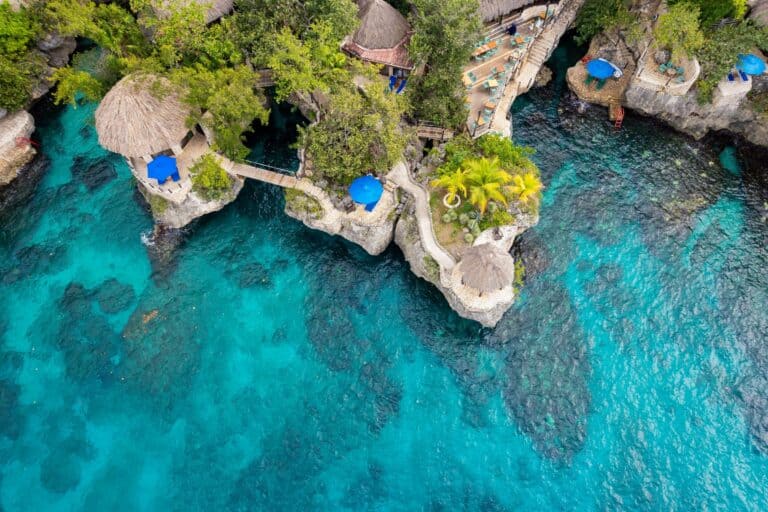 Clifftop terraces above clear water in Negril, Jamaica
