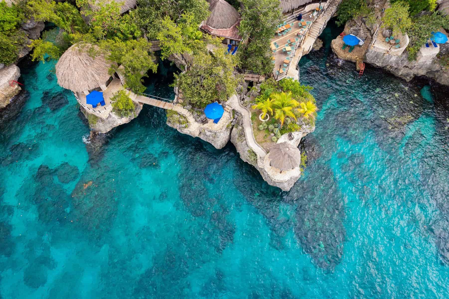 Clifftop terraces above clear water in Negril, Jamaica