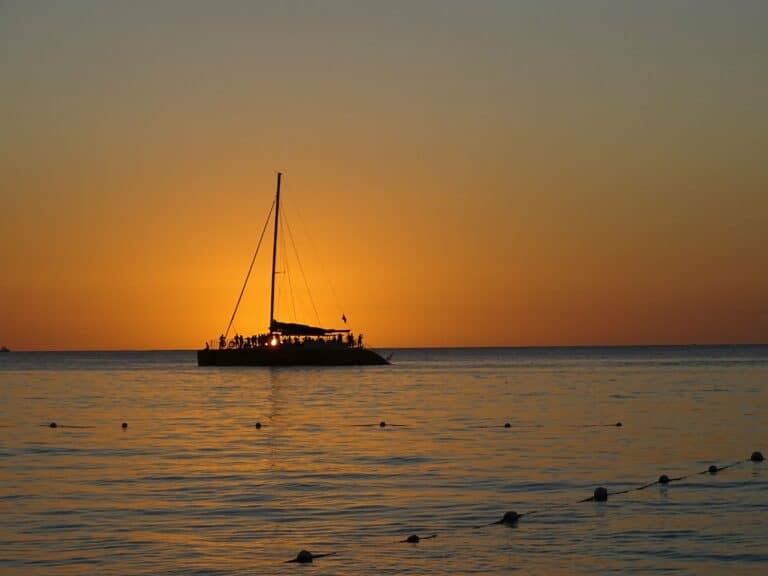 A sailing boat at sunset off Negril, Jamaica