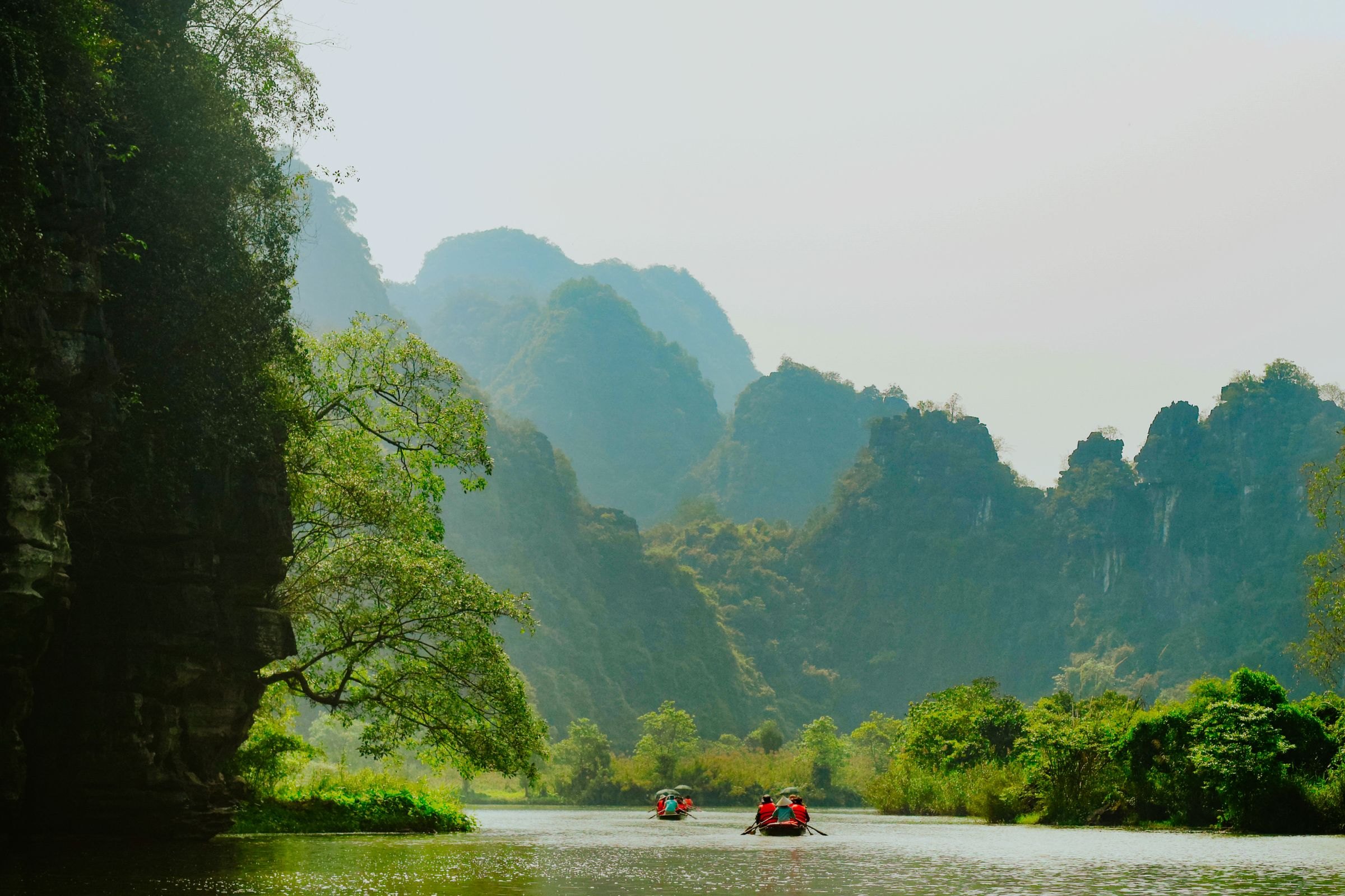 Boats on a river among the karsts of Ninh Binh