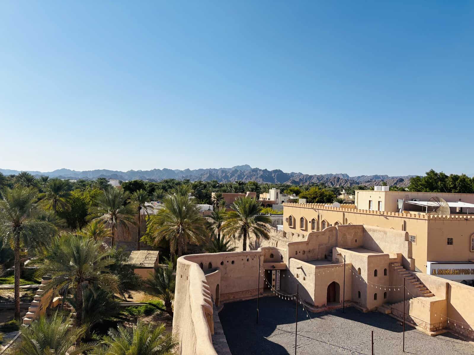 Nizwa Fort and its oasis beneath the Hajar Mountains, Oman
