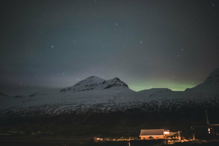 The Northern Lights above snowy mountains in Iceland