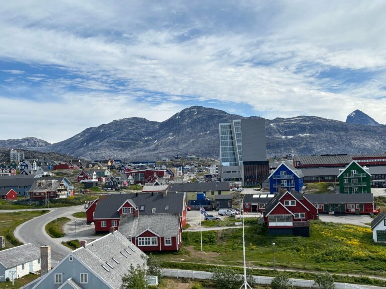 Nuuk and its colourful buildings below the mountains