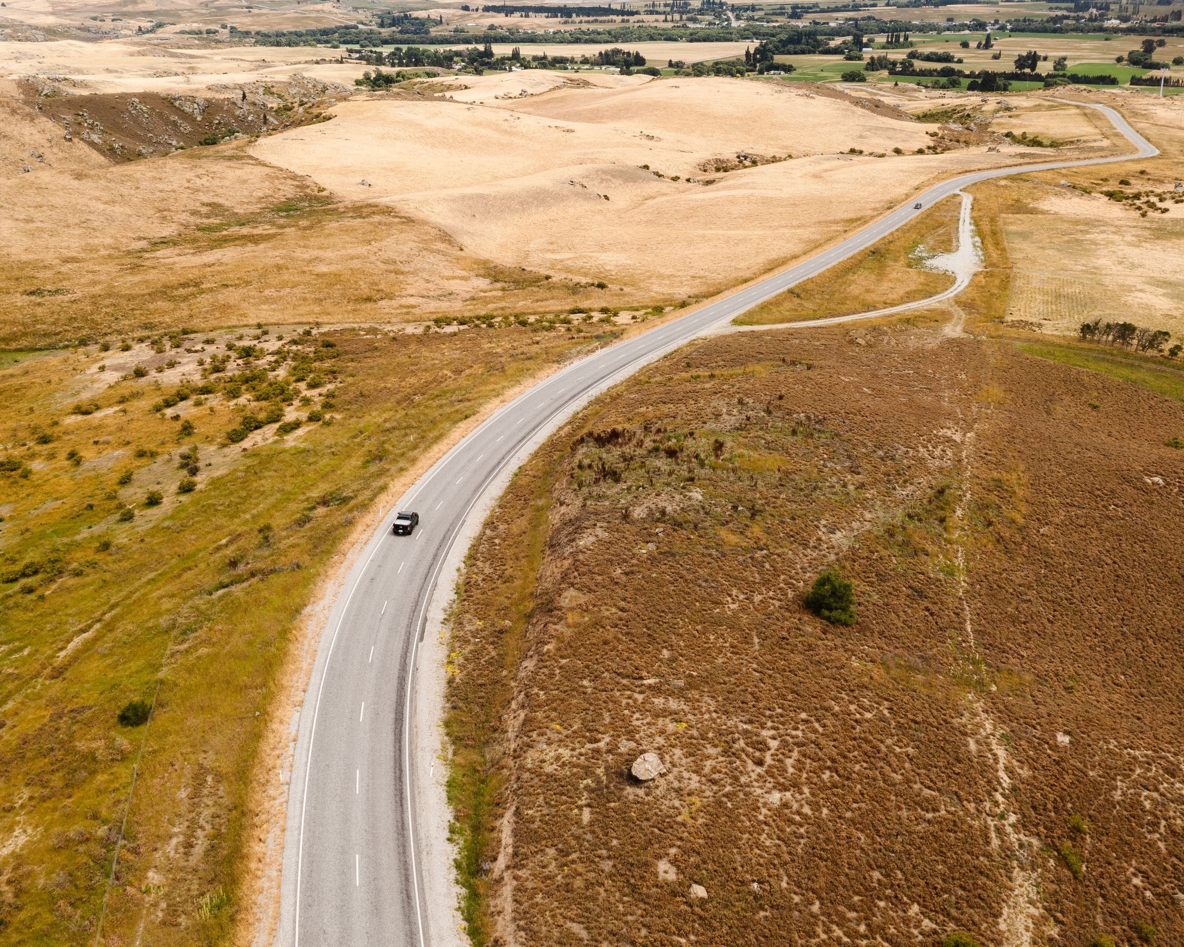 A road winding through the golden hills of Otago