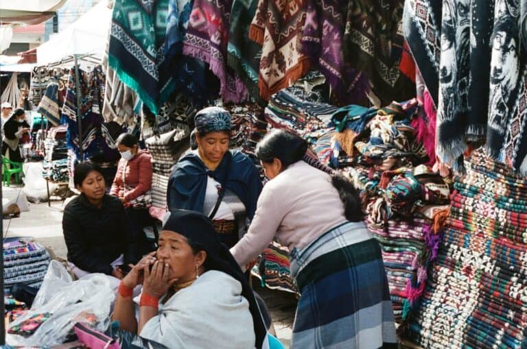 Textiles and vendors at Otavalo market, Ecuador