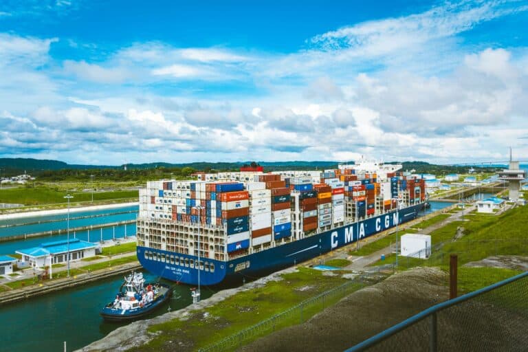 A cargo ship passing through the Panama Canal