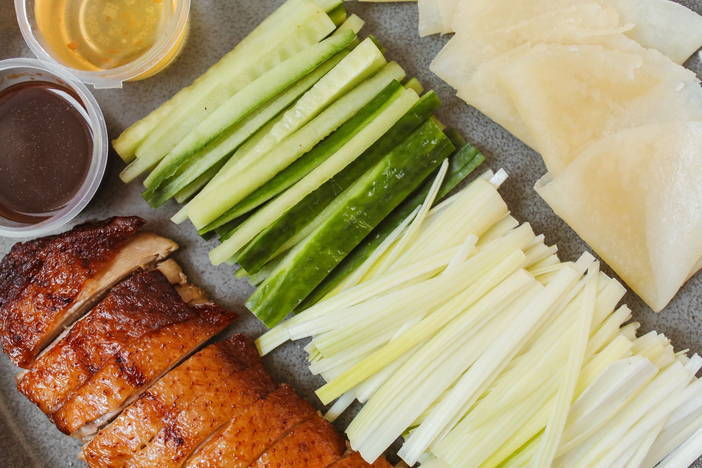 Peking duck with pancakes, cucumber and spring onion