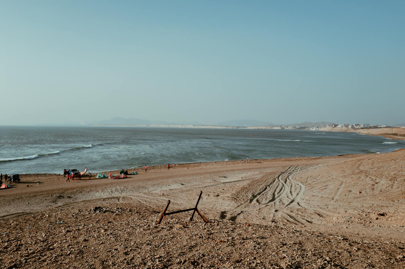 Expansive view of Pacasmayo beach with clear blue skies and ocean, northern Peru