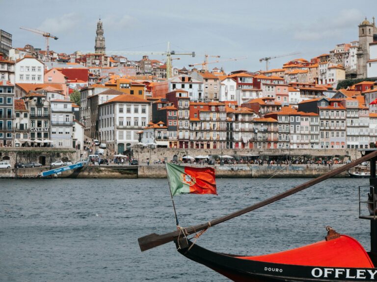The Ribeira district of Porto with a rabelo boat on the Douro