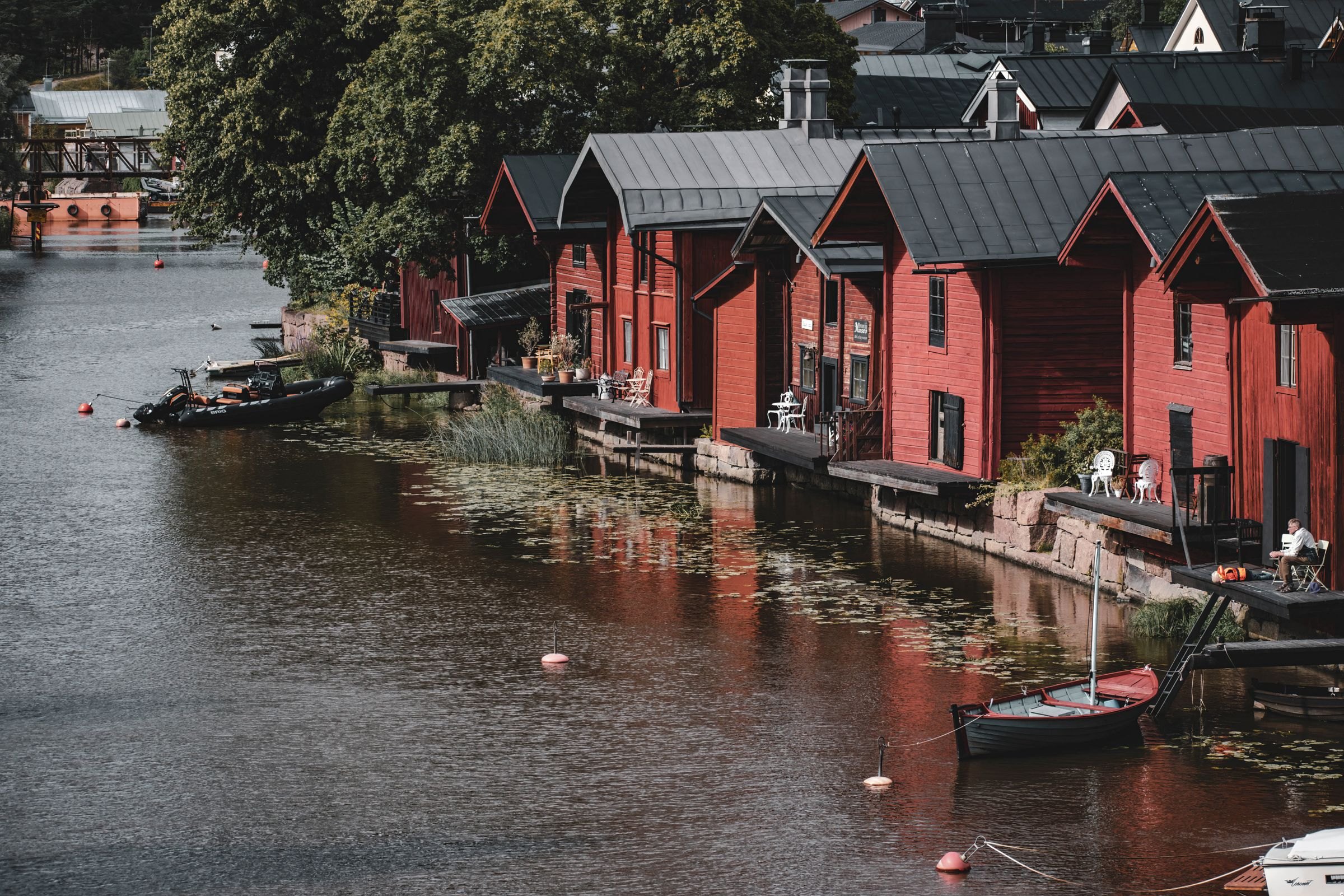 Red wooden warehouses on the river at Porvoo