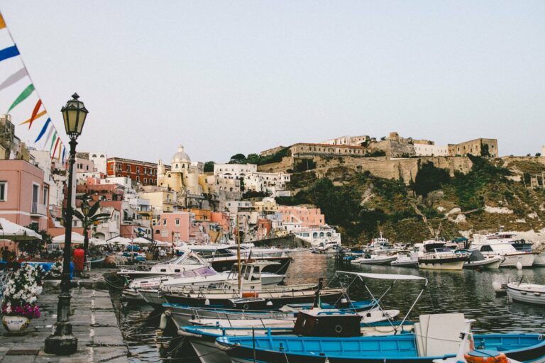 Colourful houses and boats in Procida's harbour
