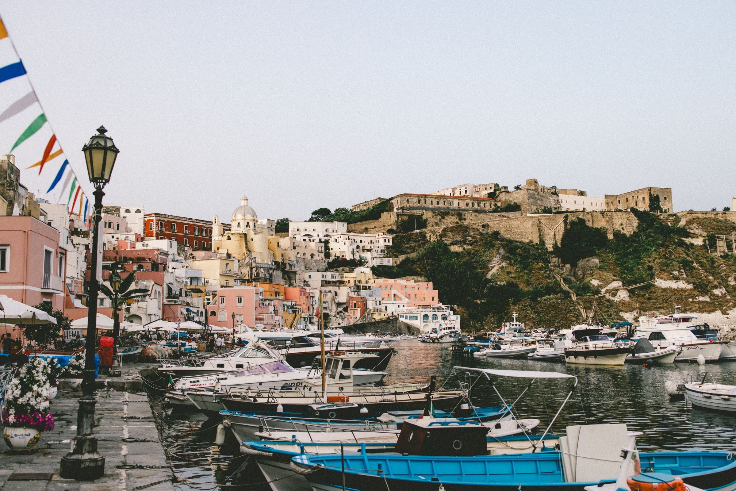 Colourful houses and boats in Procida's harbour