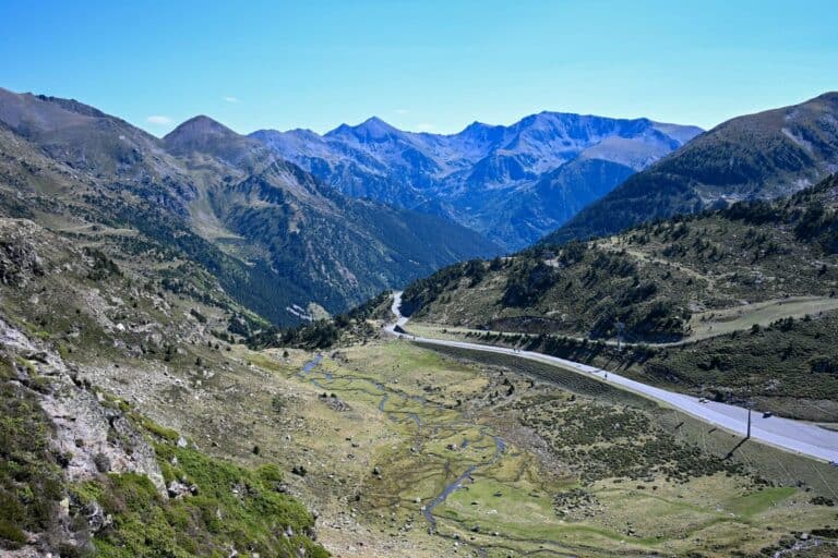 A road winding through a high valley in the Pyrenees of Andorra