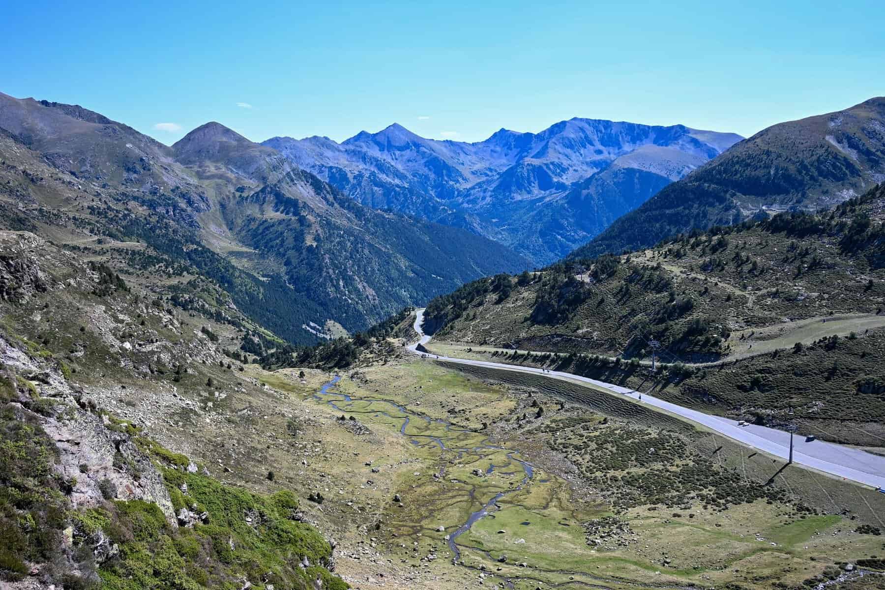 A road winding through a high valley in the Pyrenees of Andorra