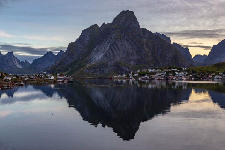 Reine and its mountains reflected at dusk