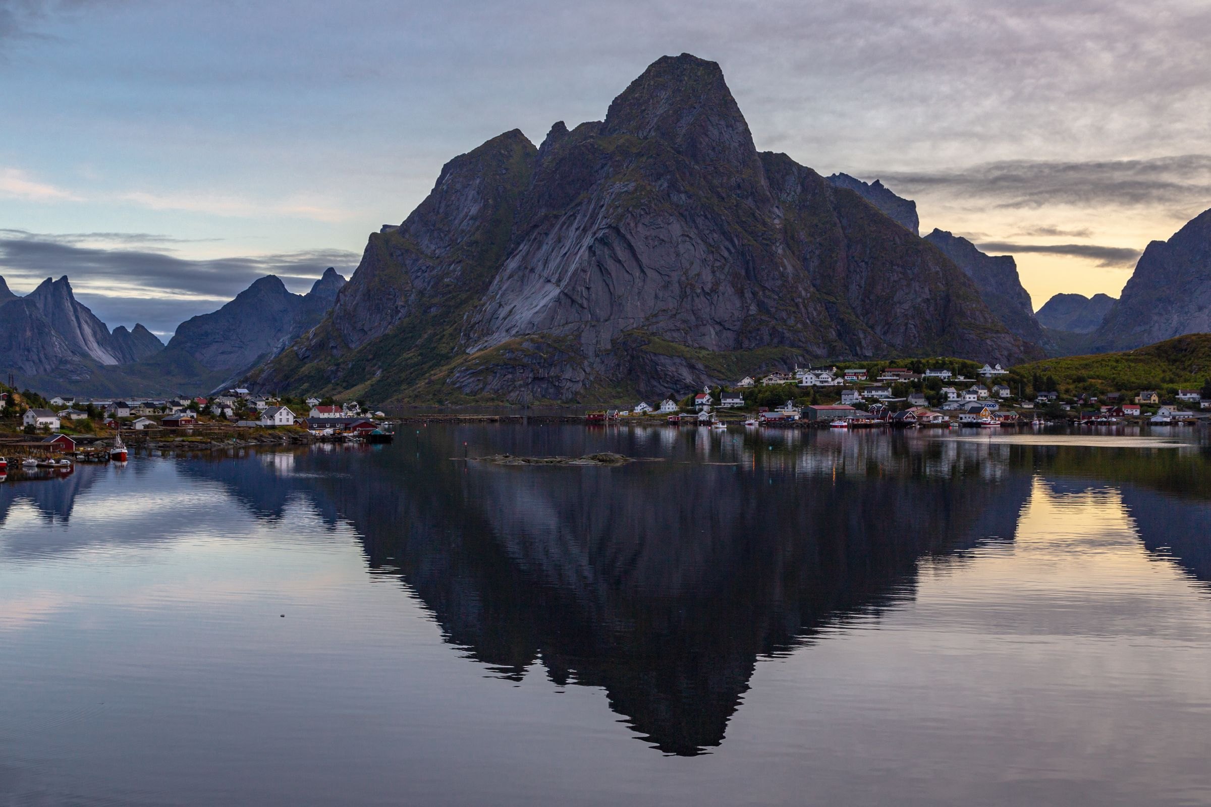 Reine and its mountains reflected at dusk