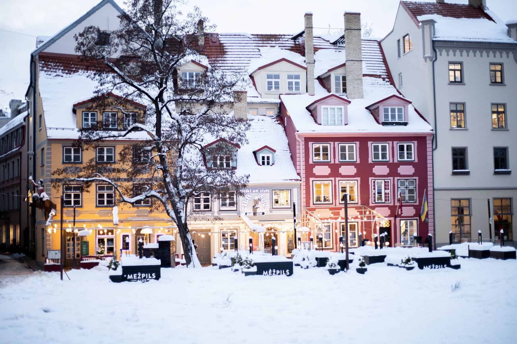 Snow-covered facades on a square in Riga's Old Town, Latvia