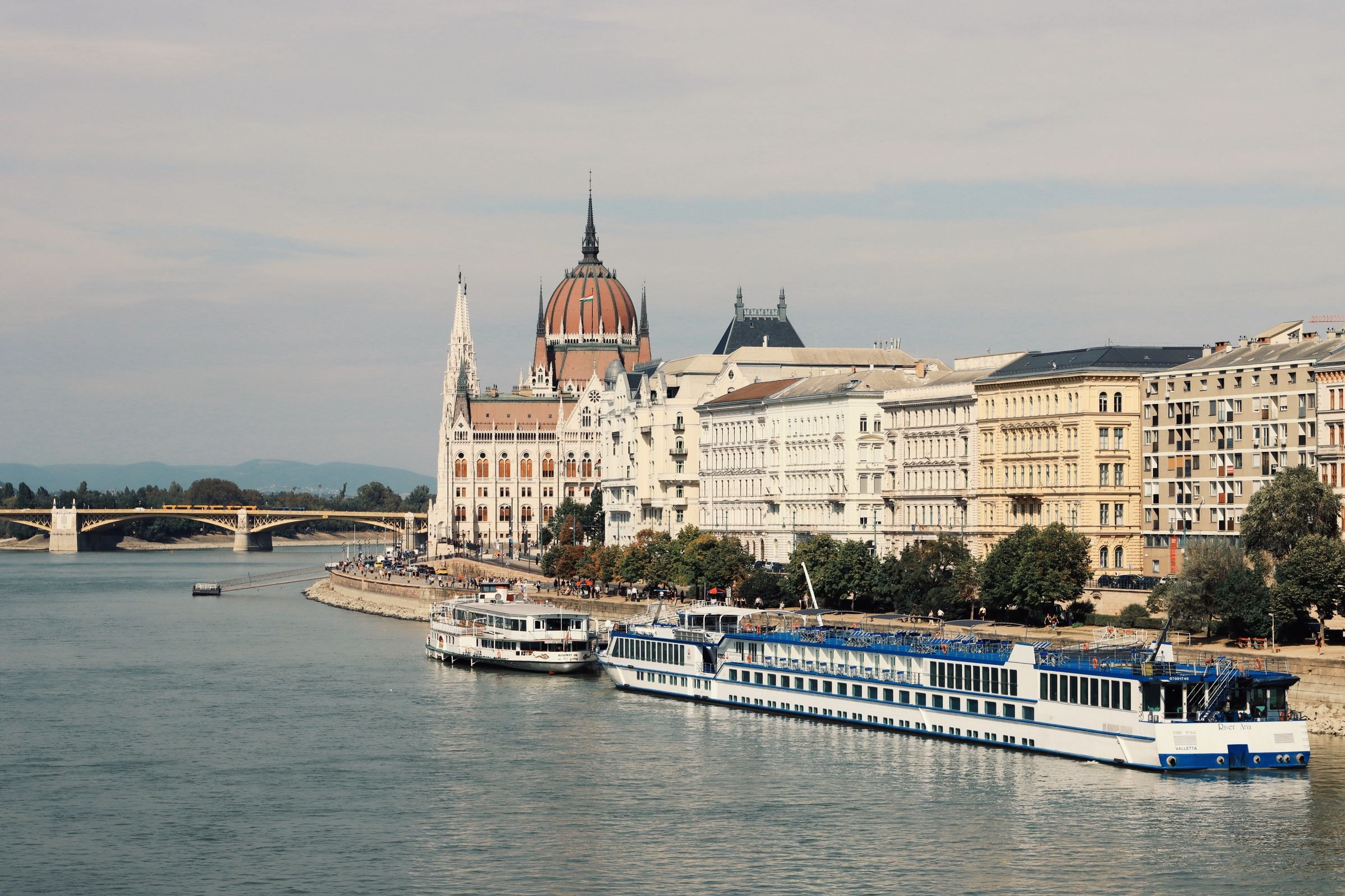 A river cruise ship below the Hungarian Parliament