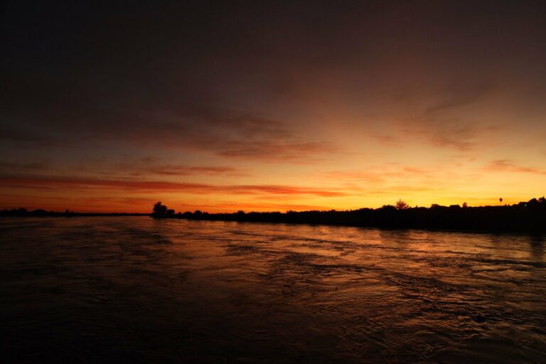 Sunset over a calm African river