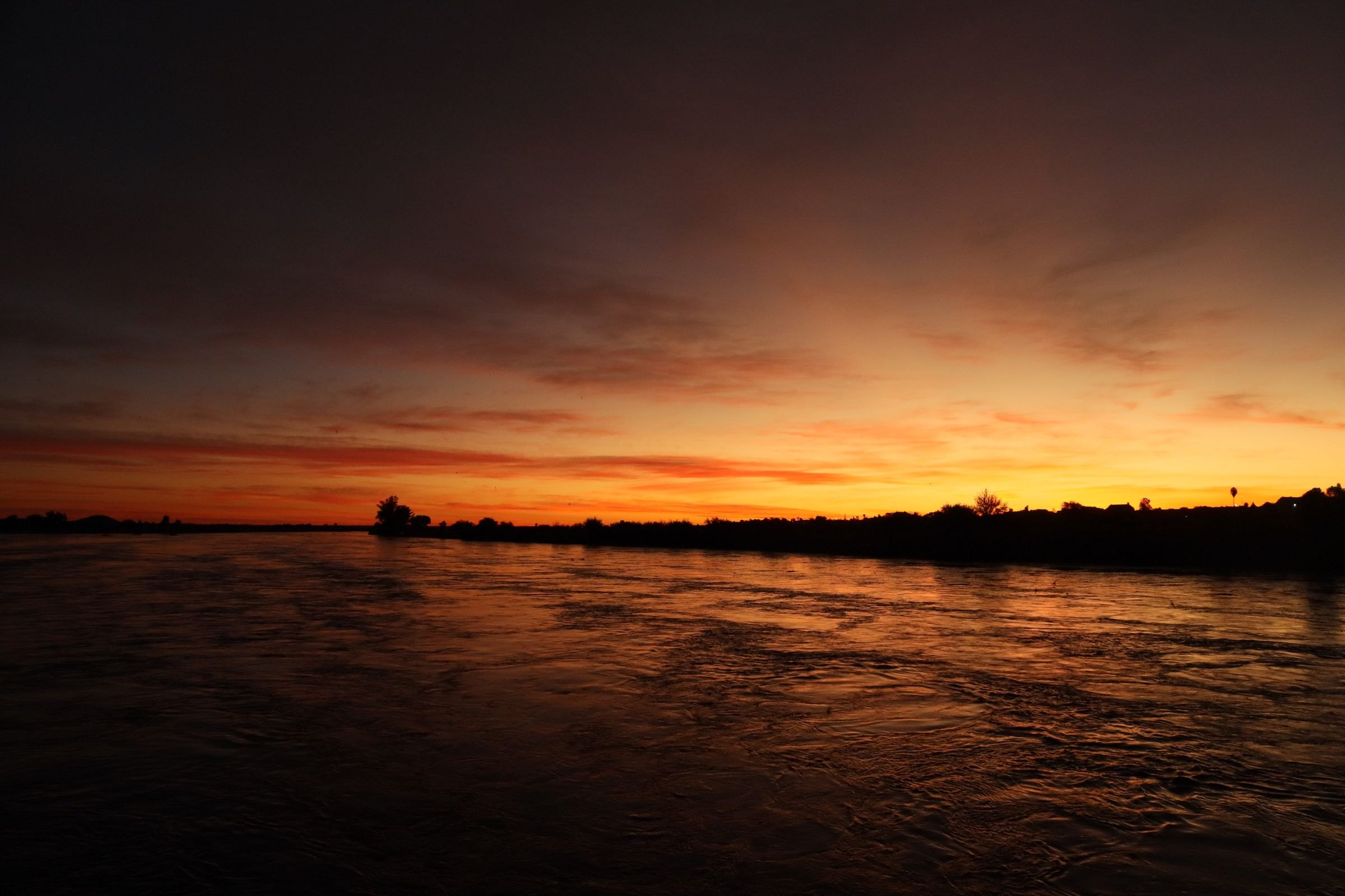 Sunset over a calm African river