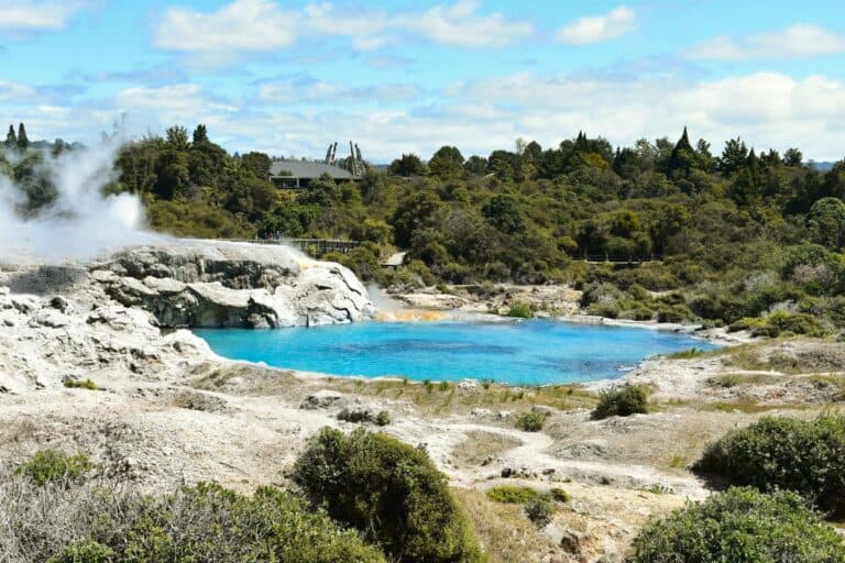 A geothermal landscape and blue lake near Rotorua, New Zealand