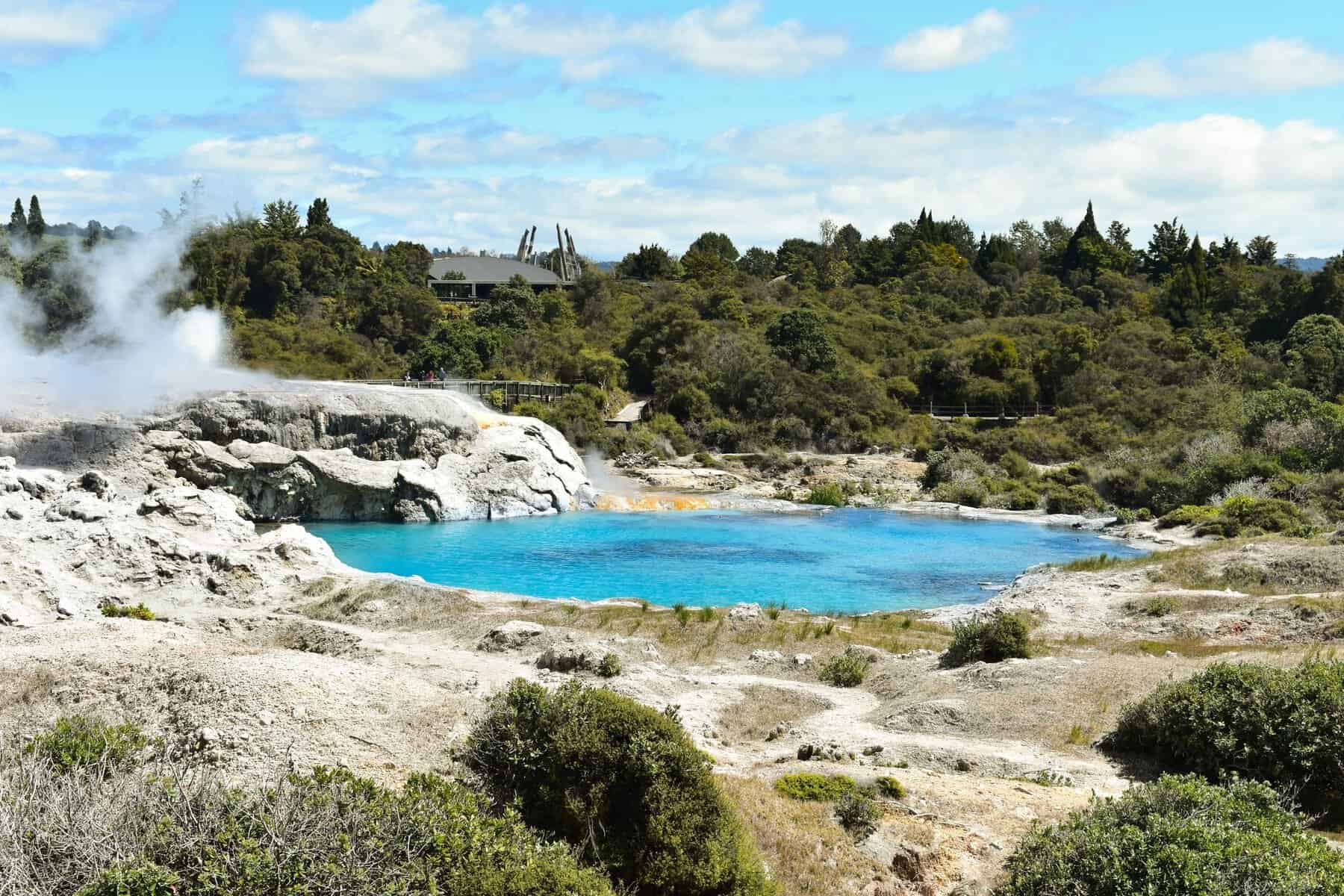 A geothermal landscape and blue lake near Rotorua, New Zealand