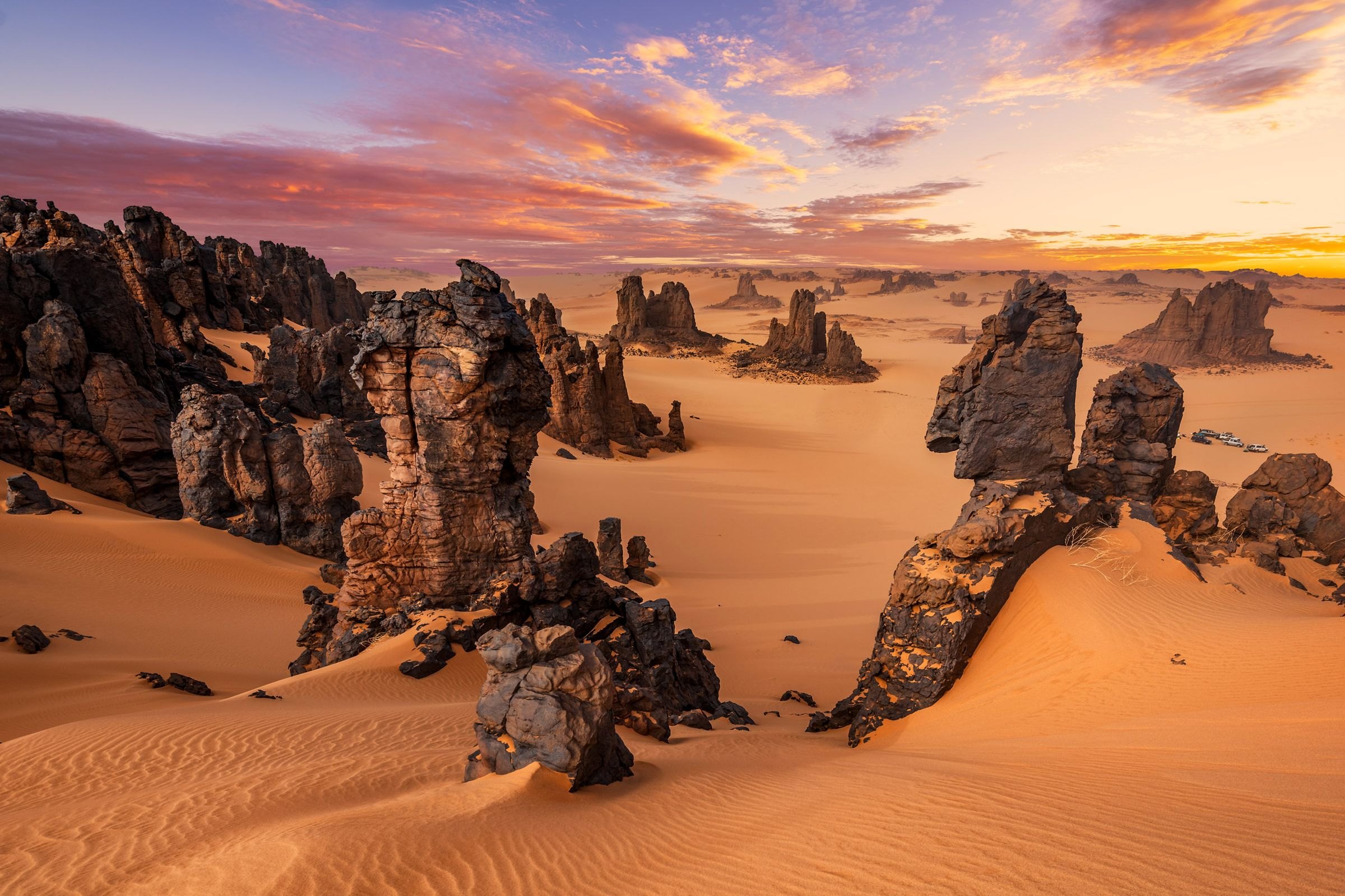 Wind-carved rocks and dunes in the Algerian Sahara