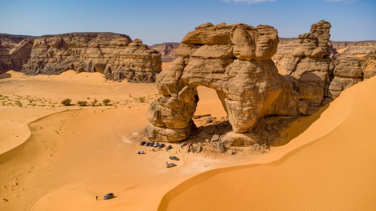 A natural stone arch among the dunes of the Algerian Sahara