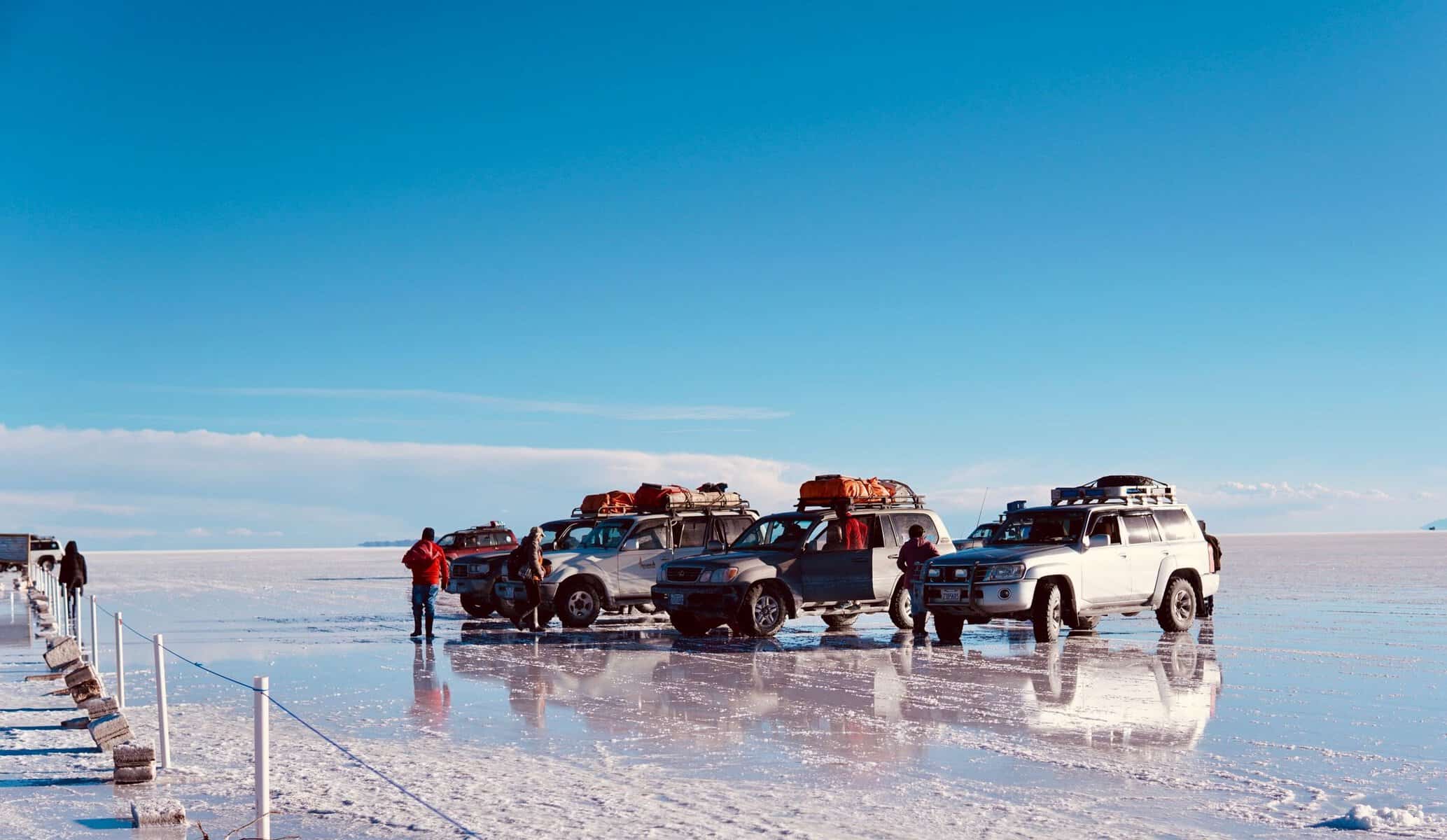 4x4s on the reflective Salar de Uyuni, Bolivia
