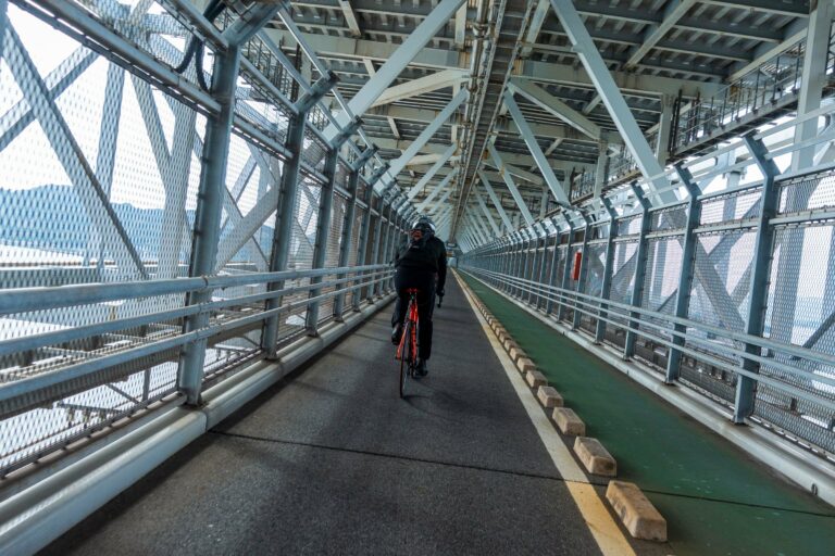 A cyclist on the Shimanami Kaido bridge path