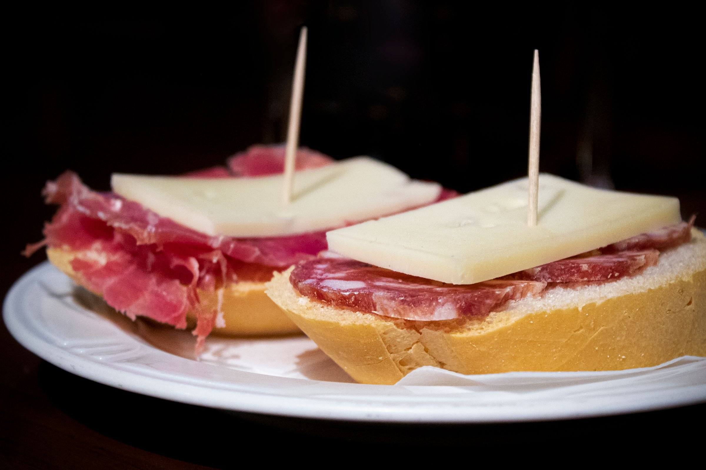 Traditional pintxos with ham and cheese