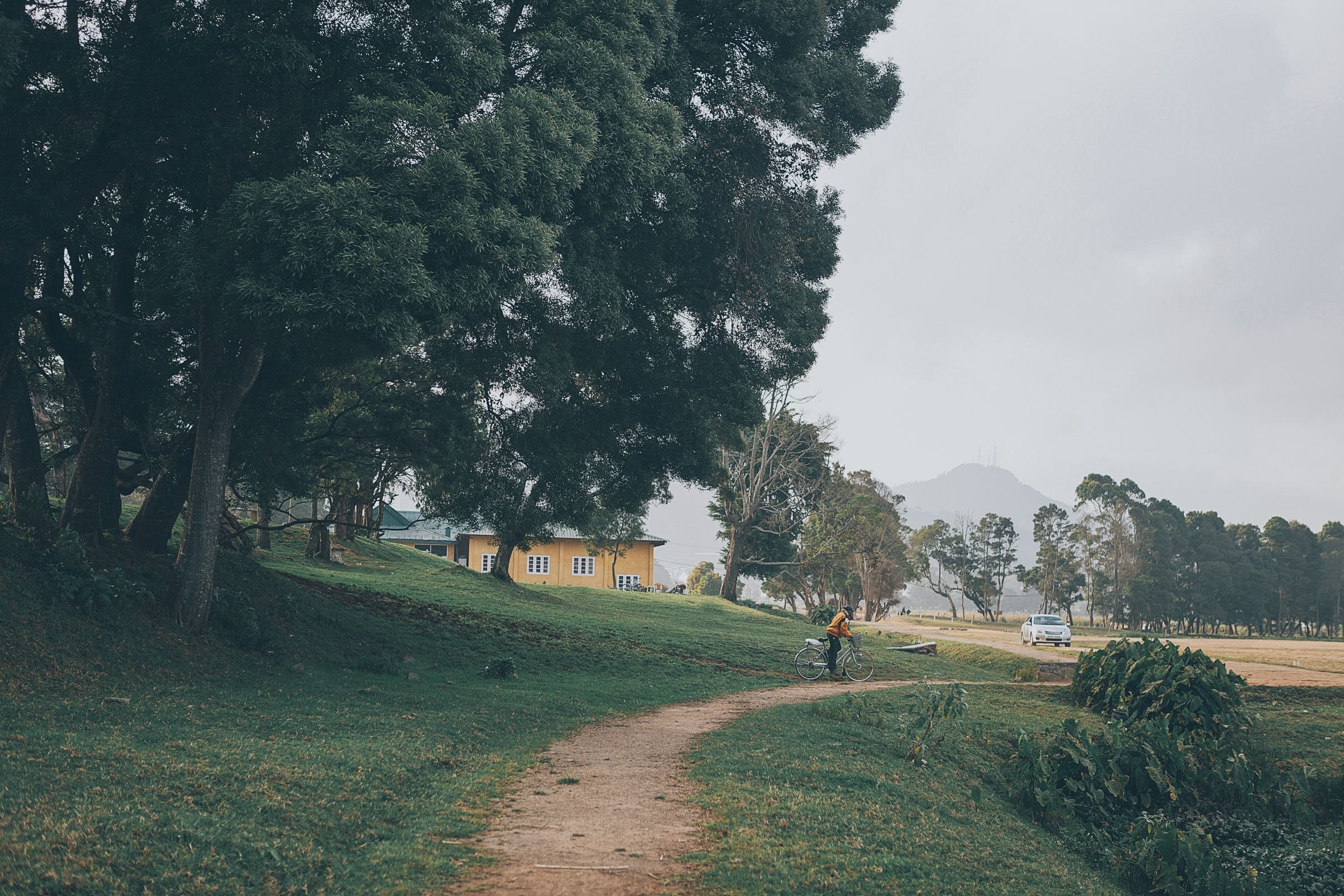 A cyclist on a country path in Sri Lanka