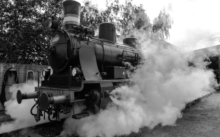 A steam locomotive releasing steam