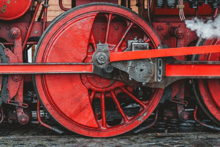 The red wheel of a vintage steam locomotive