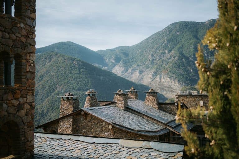 Stone houses with slate roofs beneath the mountains of Andorra