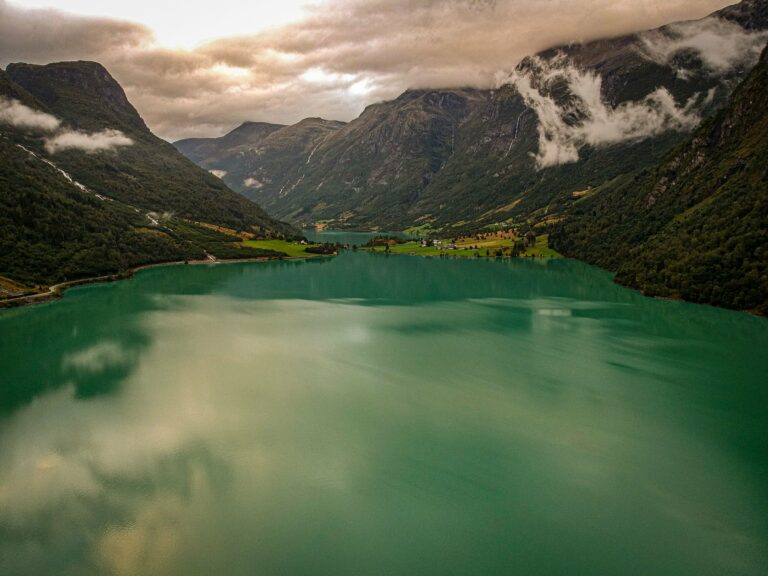 A green glacial lake among mountains near Stryn