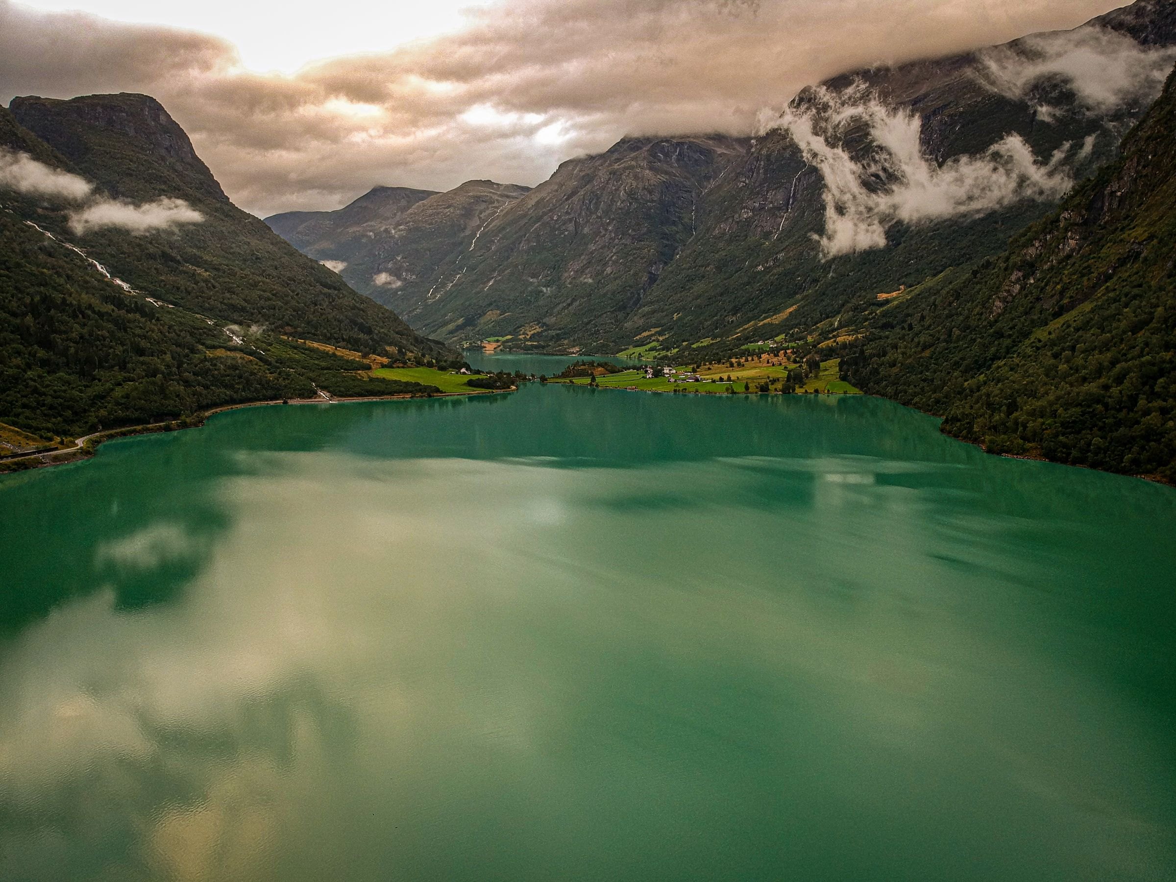 A green glacial lake among mountains near Stryn