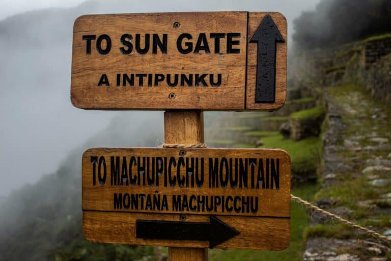 A signpost to the Sun Gate and Machu Picchu Mountain
