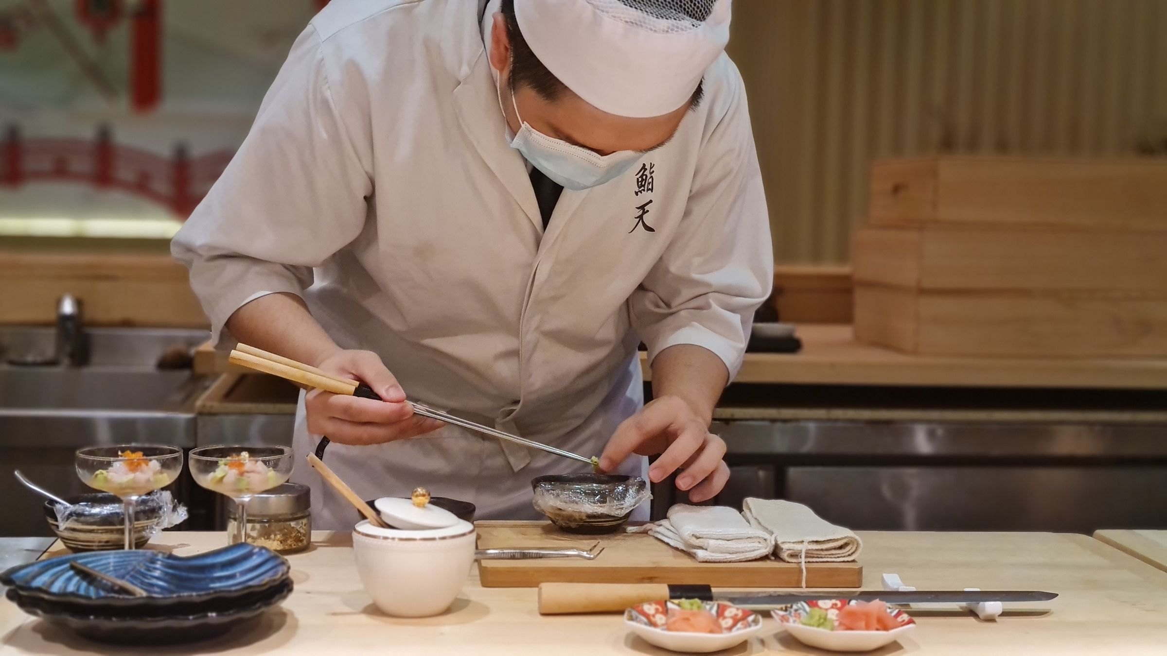 A Japanese chef preparing sashimi
