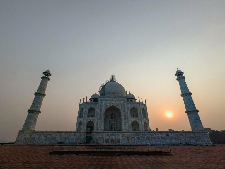 The Taj Mahal with the sun rising beside it