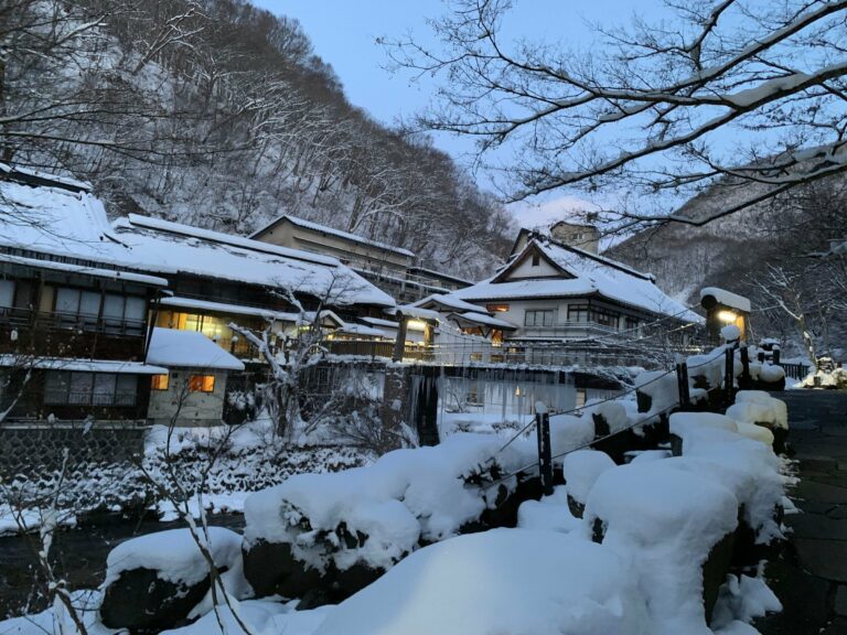 A snow-covered village in the Japanese Alps at twilight