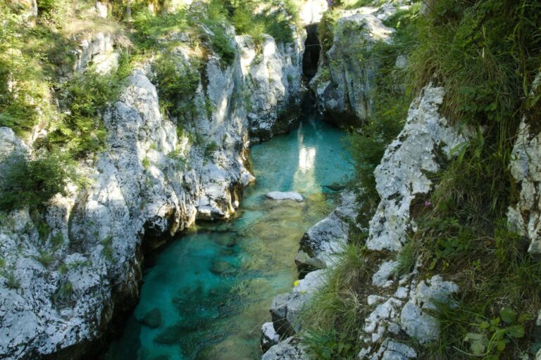 A turquoise river winding through a canyon