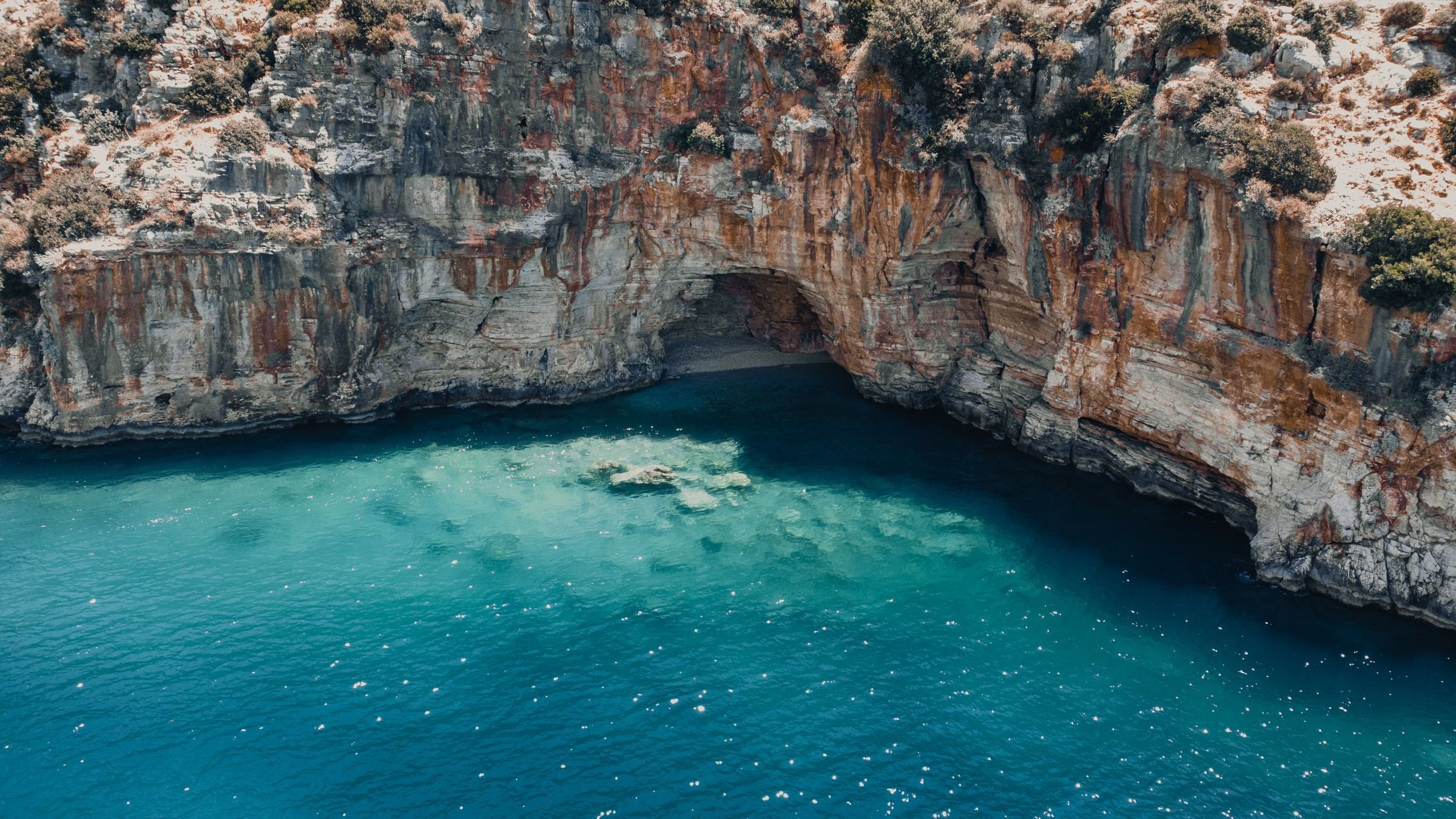 A turquoise cove beneath cliffs on the Turkish coast