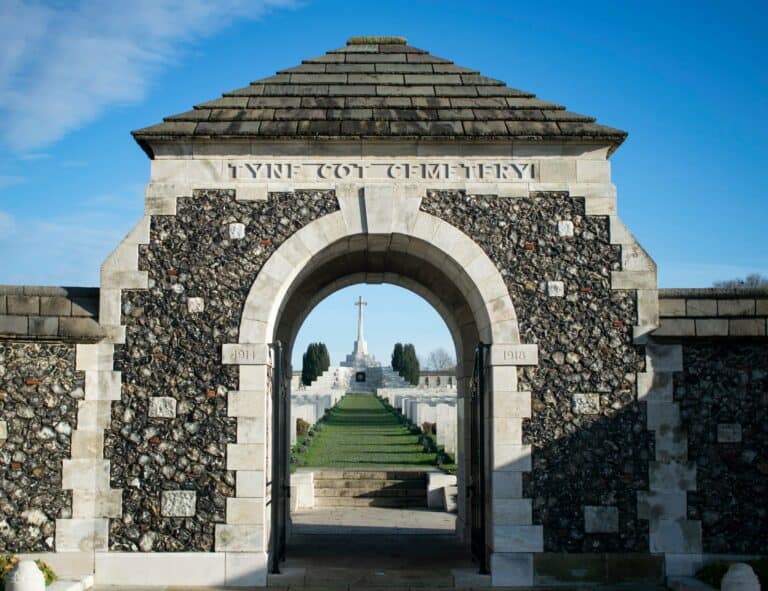 The entrance to Tyne Cot Cemetery and its Cross of Sacrifice