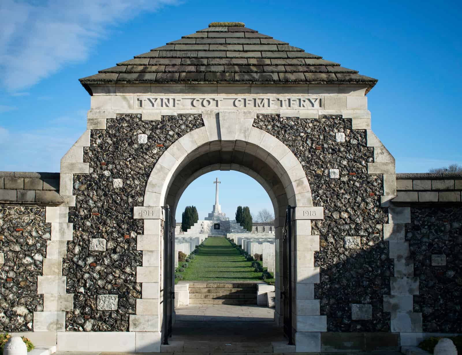 The entrance to Tyne Cot Cemetery and its Cross of Sacrifice