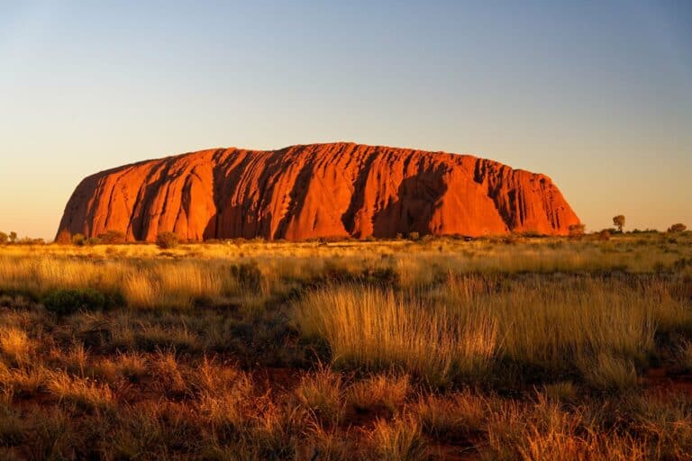Uluru glowing red at sunrise, Australia